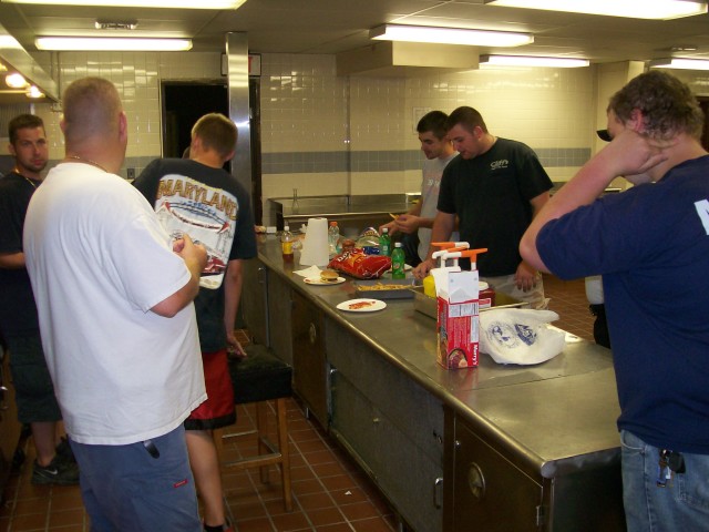 Members chill in the kitchen over a late night snack